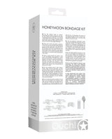 Shots Ouch Honeymoon Bondage Kit White packaging showcasing its contents and features for sensual restraint play.