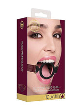 Ouch Halo Silicone Ring Gag Burgundy packaging featuring a model demonstrating its stylish design and function.