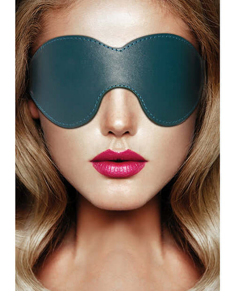 Shots Ouch Halo Leather Eyemask Blindfold Green on a model with blonde hair and bold lips.