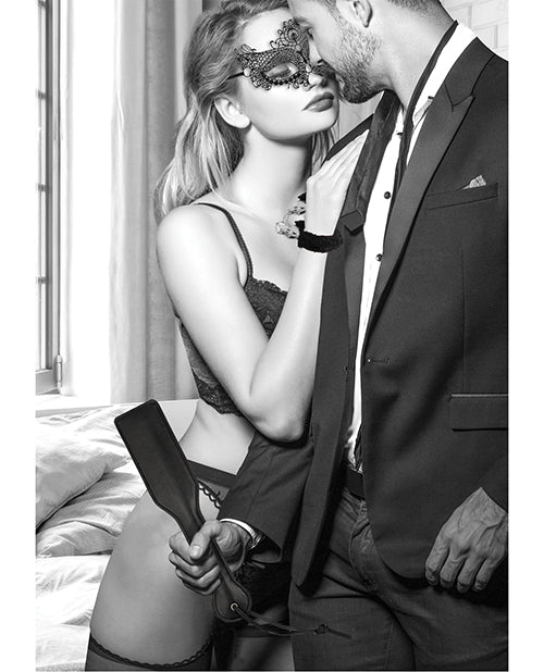 Ouch Black & White Introductory Bondage Kit 3 Black featuring a couple in a seductive pose with a mask and whip.