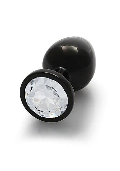 Round Gem Butt Plug Medium Gunmetal Diamond displayed with a sparkling acrylic faux diamond base.