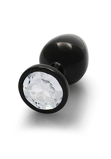 Round Gem Butt Plug Medium Gunmetal Diamond displayed with a sparkling acrylic faux diamond base.