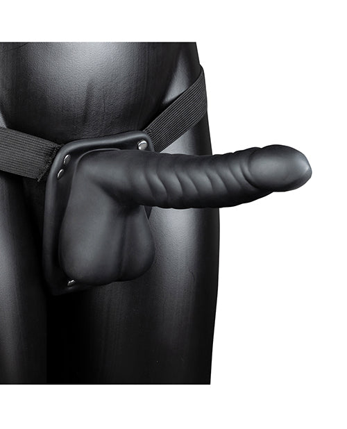 Shots Ouch 8 Inch Ribbed Hollow Strap On with Balls Black displayed on a model, showcasing its design and features.