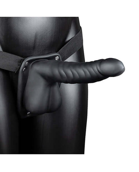 Shots Ouch 8 Inch Ribbed Hollow Strap On with Balls Black displayed on a model, showcasing its design and features.