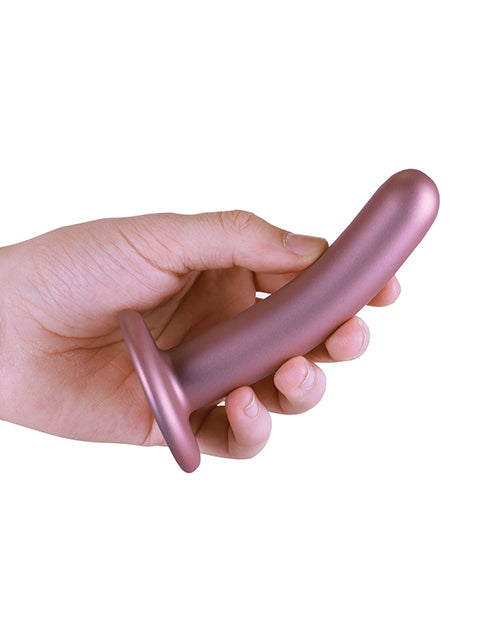 Shots Ouch 5 inch Smooth G-Spot Dildo Rose Gold held in hand, showcasing its sleek design and luxurious finish.