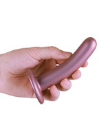 Shots Ouch 5 inch Smooth G-Spot Dildo Rose Gold held in hand, showcasing its sleek design and luxurious finish.