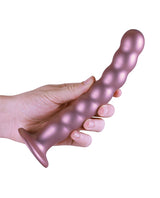 Shots Ouch 8 inch Beaded G-Spot Dildo Rose Gold held in hand, showcasing its beaded design and metallic finish.