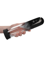 Pumped Automatic Luv Pump Black held in hand, showcasing its ergonomic design and controls for easy use.