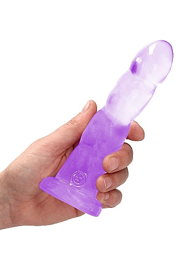 Realrock Non Realistic Dildo With Suction Cup 7 Inch Purple held in hand, showcasing its crystal-clear design.