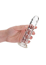 Realrock Straight Realistic 7 inch Dildo Transparent held in hand, showcasing its crystal-clear design and lifelike contours.
