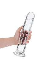 Realrock Realistic Straight Dildo 11 inches Clear held in hand, showcasing transparent design and detailed texture.