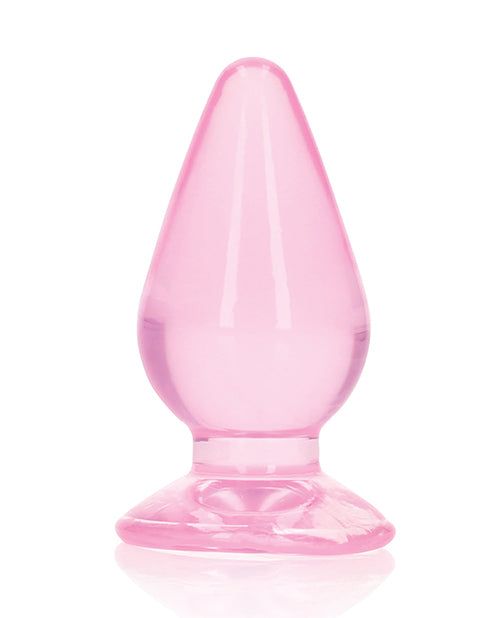 Shots RealRock Crystal Clear 3.5 inch Anal Plug Pink showcasing its tapered design and smooth finish.