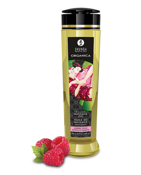 Shunga Organica Kissable Massage Oil Raspberry Feeling 8 Oz bottle with raspberries displayed.