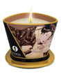 Shunga Massage Candle Intoxicating Chocolate 5.7 Oz with candle lit and decorative design.