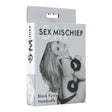 Sex & Mischief Furry Handcuffs Black packaging featuring a model with black furry handcuffs.