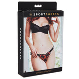 Sportsheets Saffron Strap On Harness Red Black packaging featuring a model showcasing its stylish design.