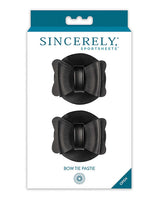 Sincerely Bow Tie Pasties Black Faux Leather packaging featuring two black bow-shaped pasties.