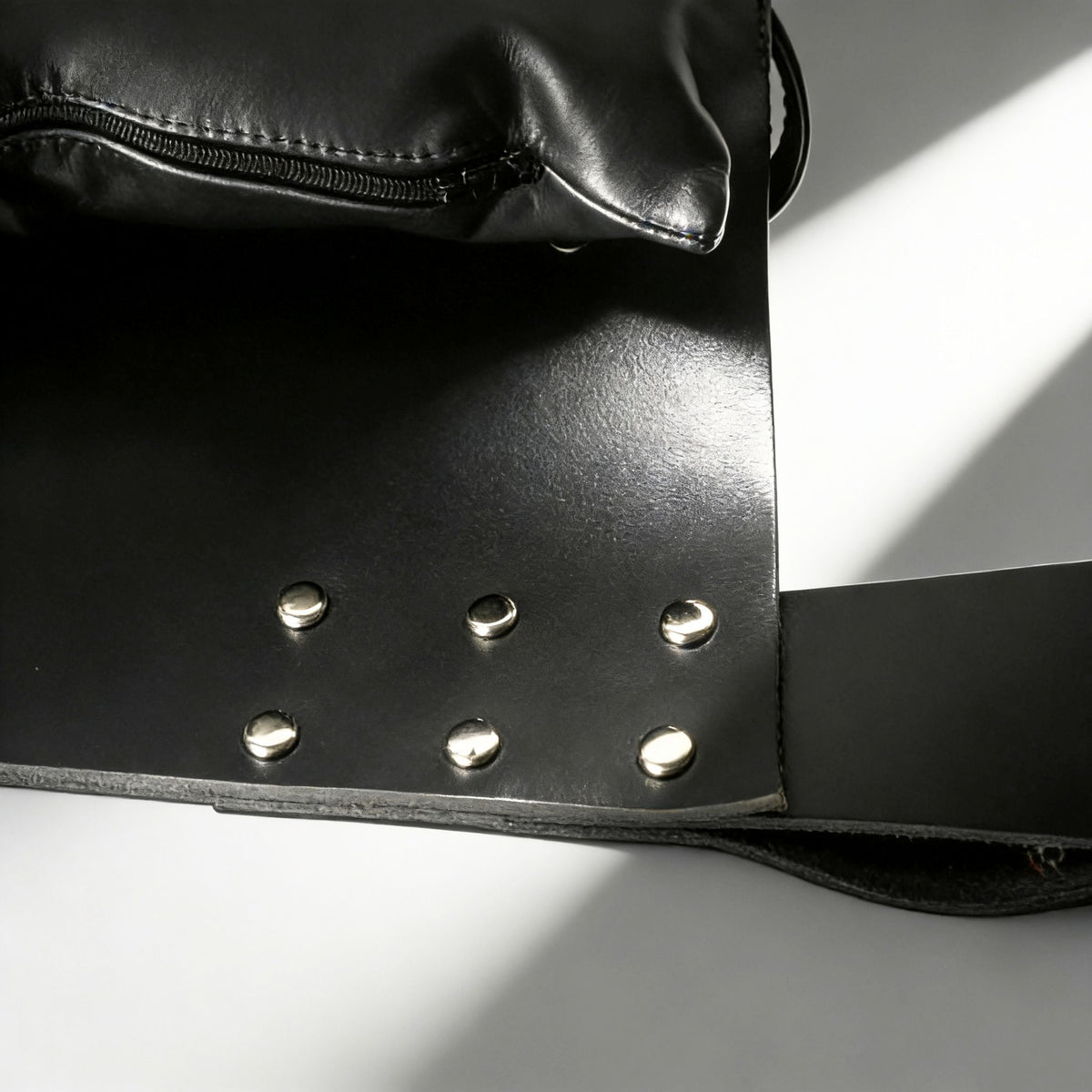 Close-up of Strict Leather Premium Sex Sling showing thick latigo leather and secure metal fittings.