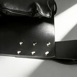 Close-up of Strict Leather Premium Sex Sling showing thick latigo leather and secure metal fittings.