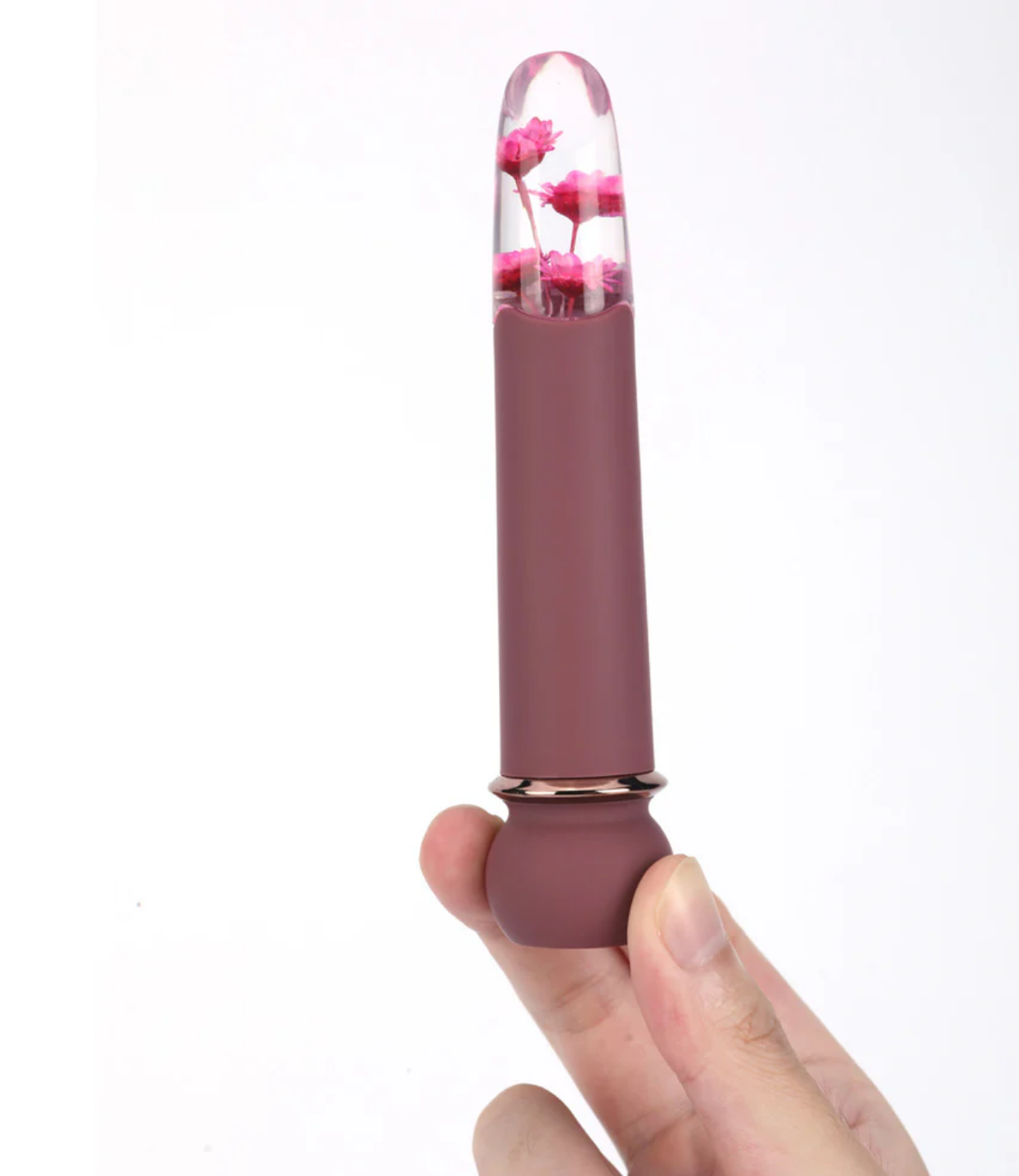 Maia Flora Fiercely Powerful Bullet Vibrator Burgundy held in hand featuring clear acrylic tip with faux flowers.