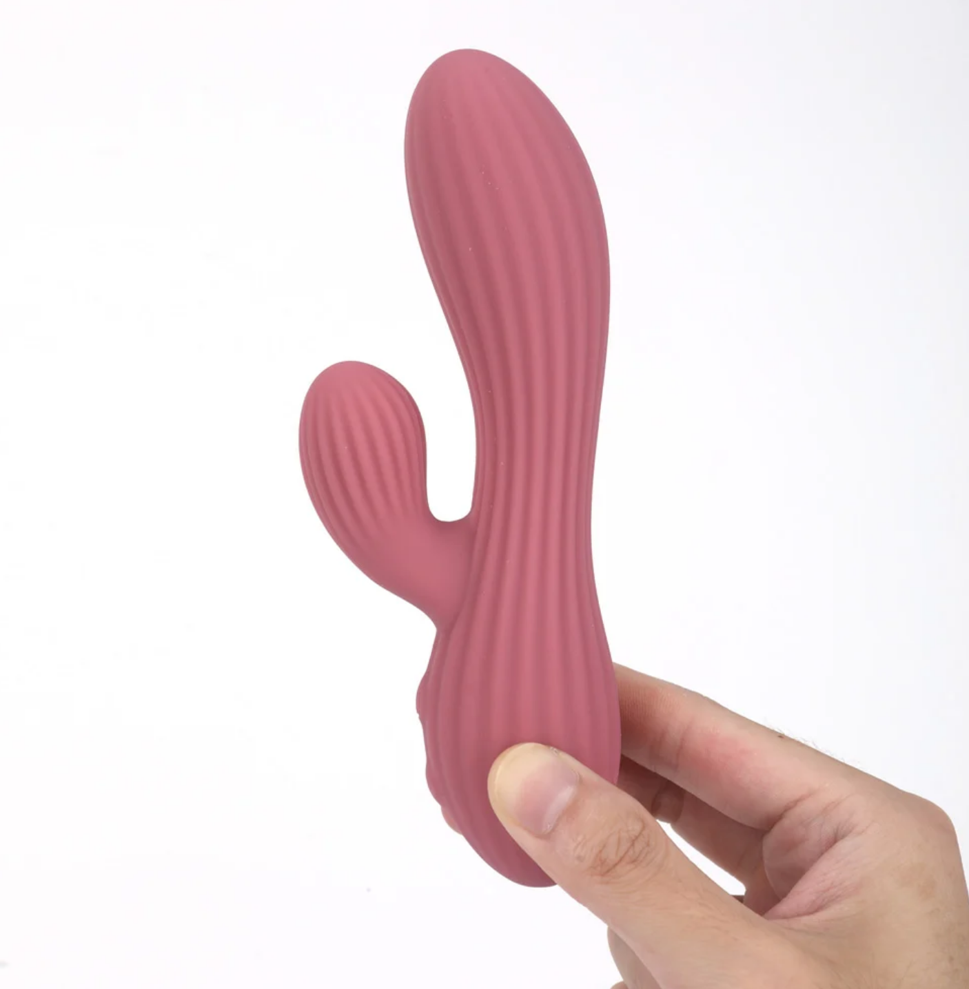 Maia Sedona Liquid Silicone Dual Stimulation Vibrator held in hand showcasing its ergonomic design and texture.