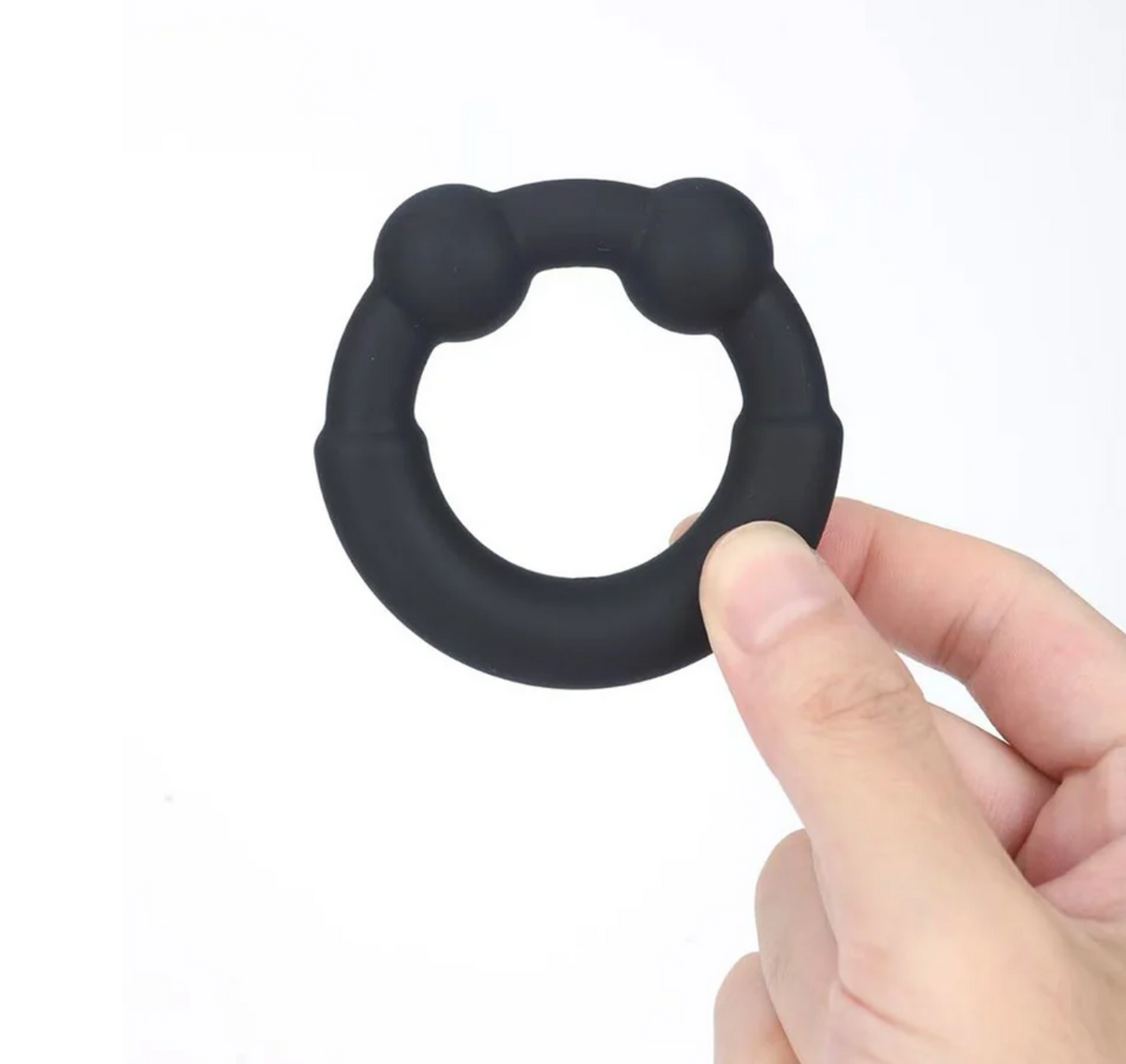 Maia Axel Liquid Silicone Metal Reinforced Super Stretch C-Ring held in hand, showcasing its stretchy design.