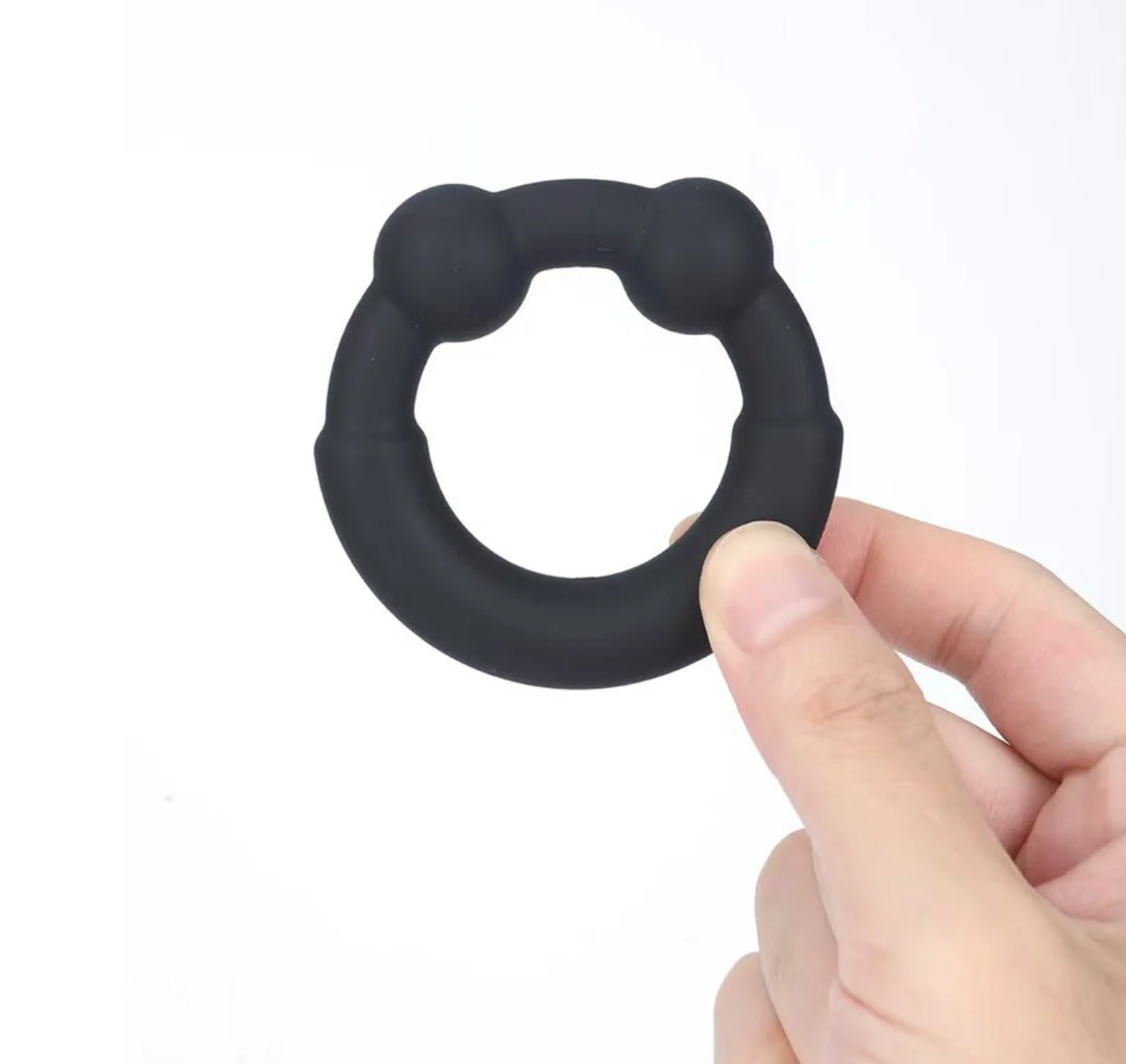 Maia Axel Liquid Silicone Metal Reinforced Super Stretch C-Ring held in hand, showcasing its stretchy design.
