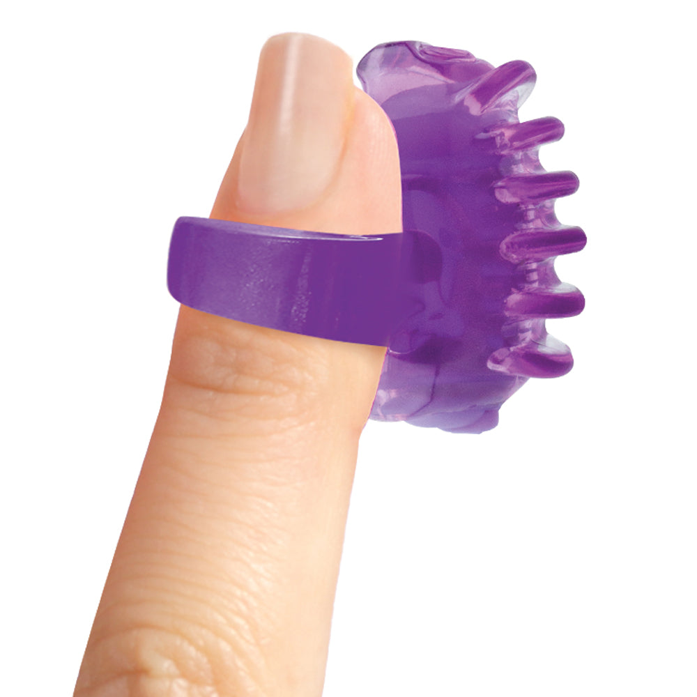 Screaming O Quickie Fing O Tips Finger Vibrator Purple securely fitted on a fingertip demonstrating its compact design.
