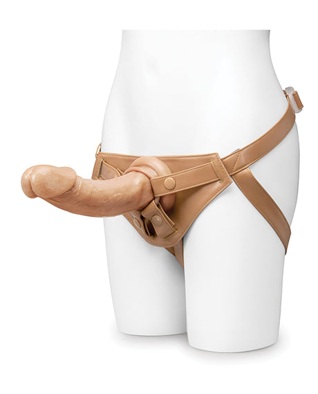 Together 9 Inch Realistic Dildo Suction Base Caramel displayed on a harness for enhanced pleasure and versatility.