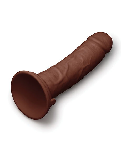 Together 8.5 Inch Realistic Dildo Suction Base Dark on a smooth surface highlighting its lifelike design and sturdy suction base.