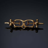 UPKO Thumb Metal Cuffs in gold, featuring a unique string mechanism for secure and discreet restraint play.