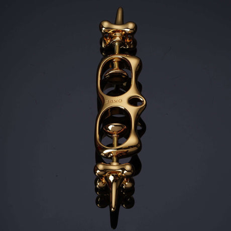 UPKO Thumb Metal Cuffs in gold, featuring a unique design for effective restraint and discipline play.