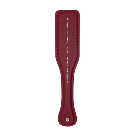 UPKO luxurious red leather paddle with embossed text, part of the Italian bondage tools set for BDSM games.
