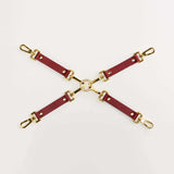 Luxury Italian leather bondage accessories set with gold hardware, designed for BDSM play and style.