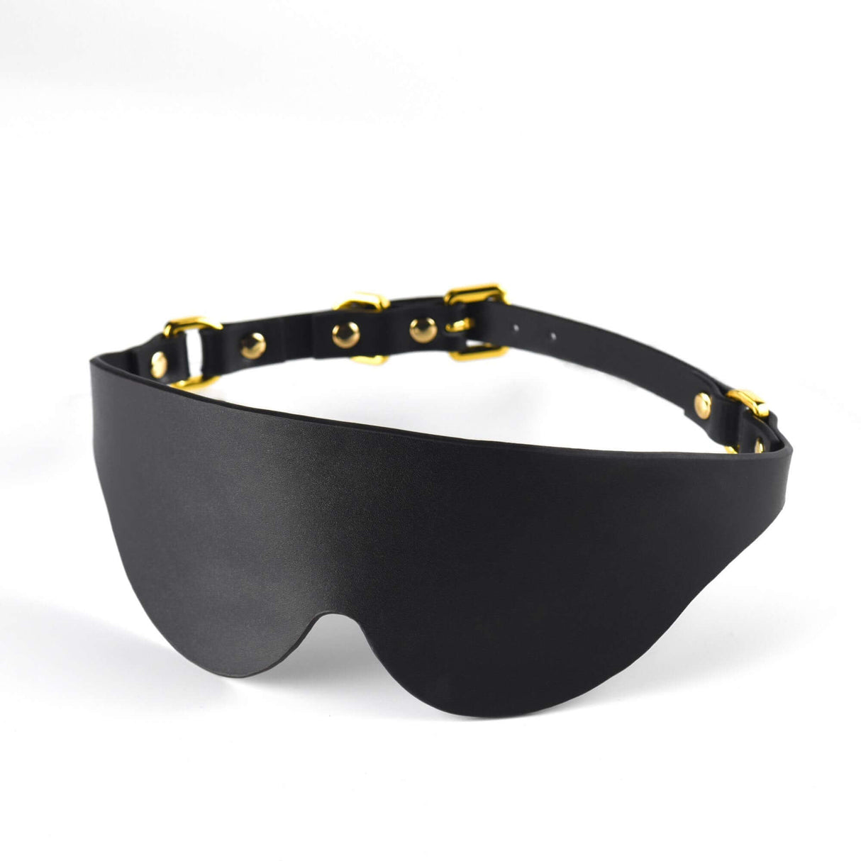 Black leather eye mask with gold hardware, part of a premium BDSM kit for enhanced sensory play.