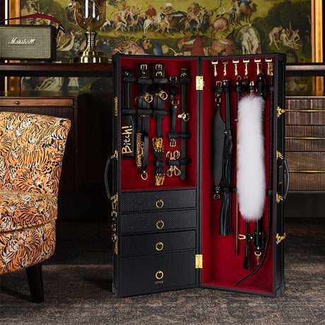 UPKO Luxury BDSM 15-piece Sade Trunk Kit displayed open, showcasing handmade Italian leather tools in a chic black trunk.