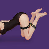 UPKO Clack bondage restraints gear on model's legs, showcasing durability and versatility in design.