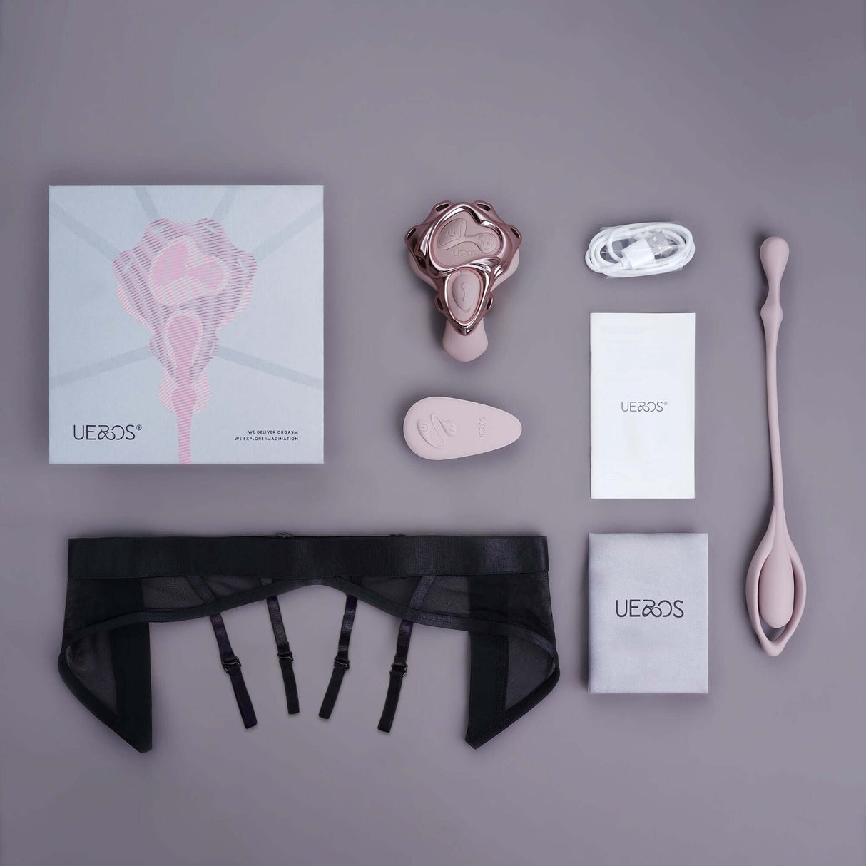 World Best Panty Vibe Massager by Ueros product packaging and accessories displayed on a grey background.