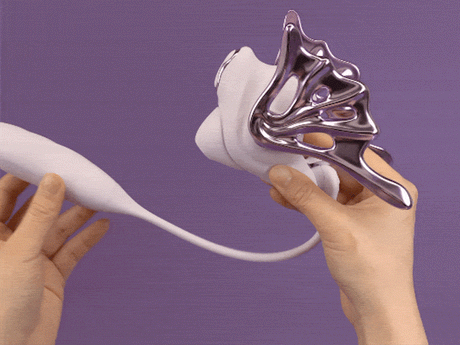 UEROS Suction & Insertable Vibrator Set Dual Function Purple held in hands demonstrating its design and features.
