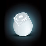 Inya the Rose Glow in the Dark Suction White, a floral air pulse stimulator with elegant design and glowing feature.