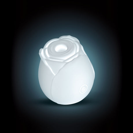 Inya the Rose Glow in the Dark Suction White, a floral air pulse stimulator with elegant design and glowing feature.