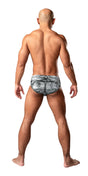 Male Power Dirty Denim Bikini Medium Denim worn by a man, showcasing the back view with playful denim print.