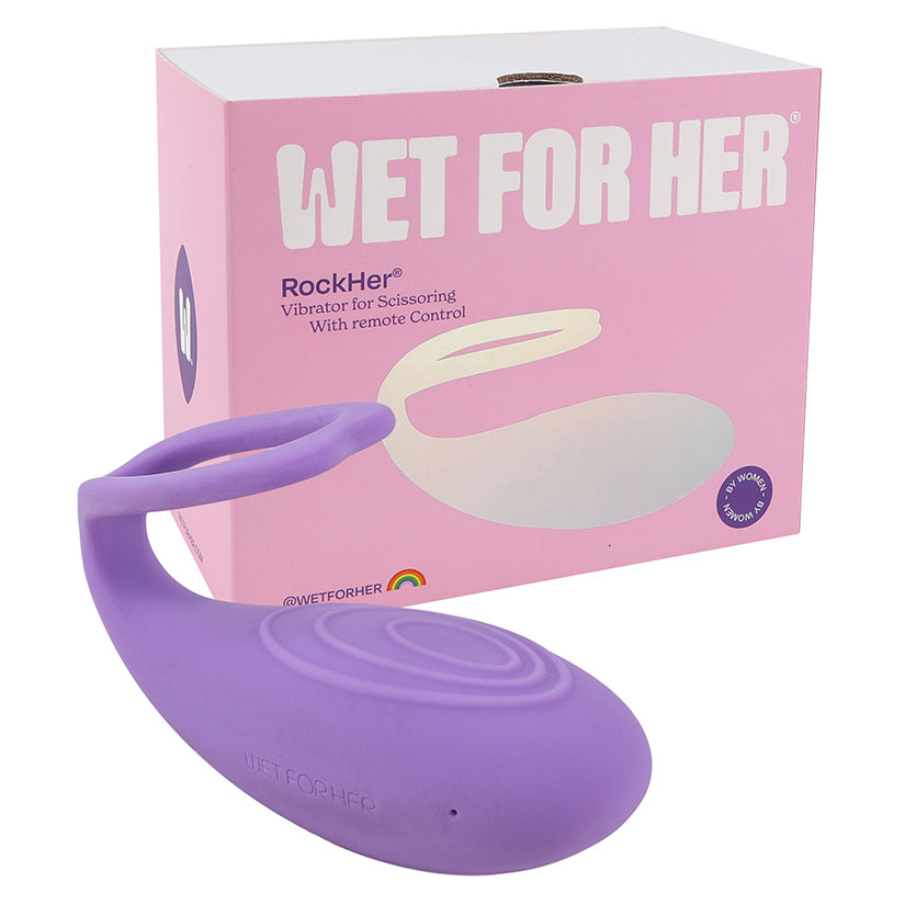 Wet For Her Rockher Vibrator 2.0 Lila in purple next to its packaging, designed for female-to-female intimacy.