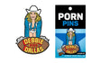 Wood Rocket Debbie Does Dallas Enamel Lapel Pin showcasing a cheeky design inspired by classic adult cinema.