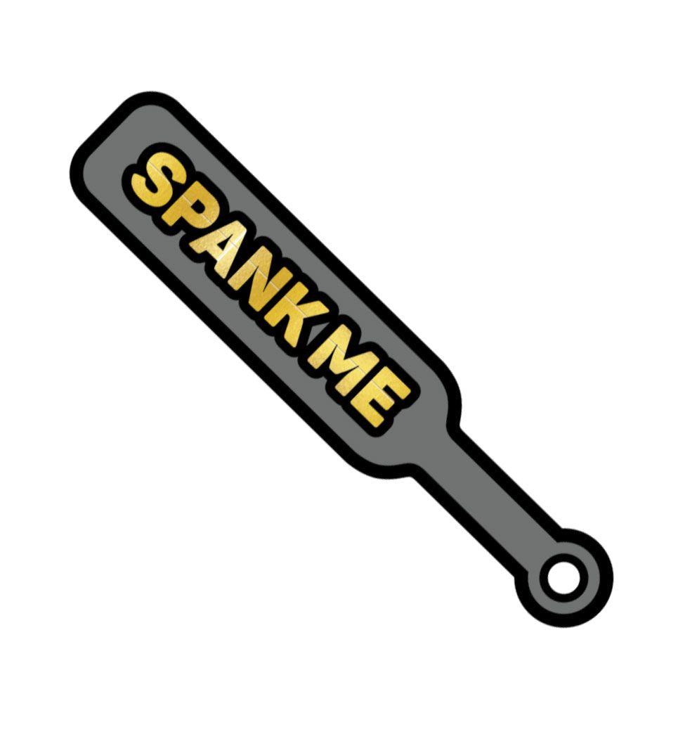 Wood Rocket Spank Me Paddle Enamel Pin Grey in playful paddle design with bold gold lettering 'Spank Me'.