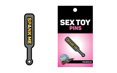 Wood Rocket Spank Me Paddle Enamel Pin Grey featuring gold lettering on a playful design.