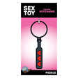 Wood Rocket Heart Paddle Enamel Keychain Black on packaging with playful design and red hearts.