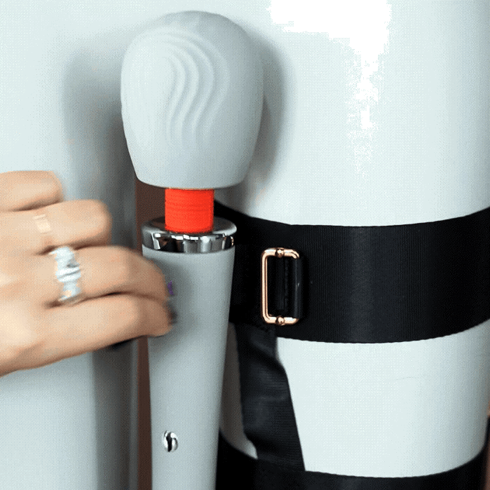 UPKO remote-control wand vibrator being secured with a thigh harness for enhanced pleasure and discreet wear.