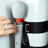 UPKO remote-control wand vibrator being secured with a thigh harness for enhanced pleasure and discreet wear.