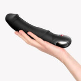 Fun Factory Big Boss Black Line Vibrator held in hand, showcasing its ergonomic design and luxury silicone material.